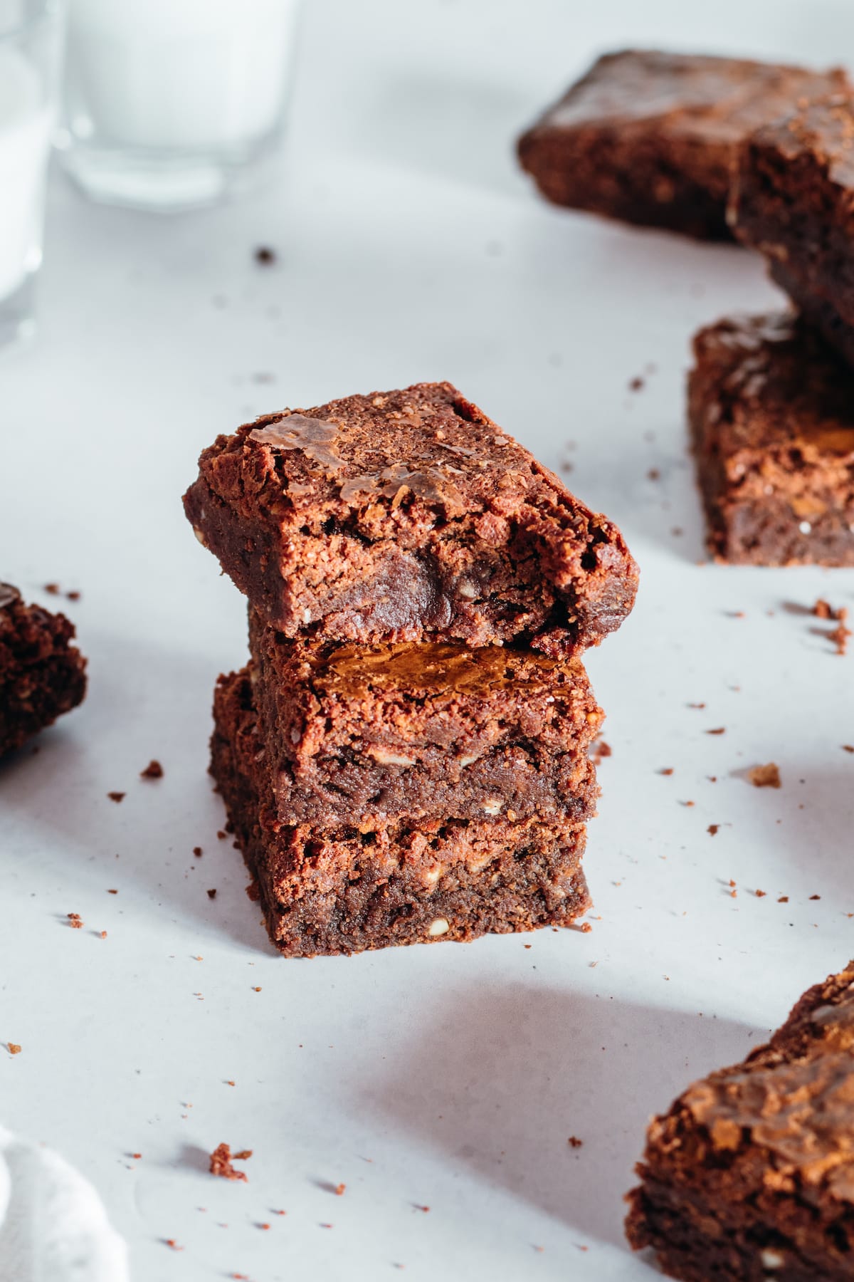 Stack of 3 brownies with top brownie bitten into