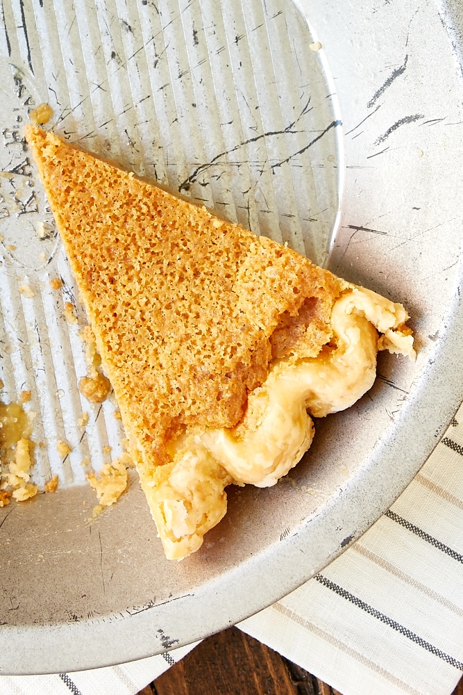 overhead view of a slice of Brown Butter Chess Pie in a pie plate