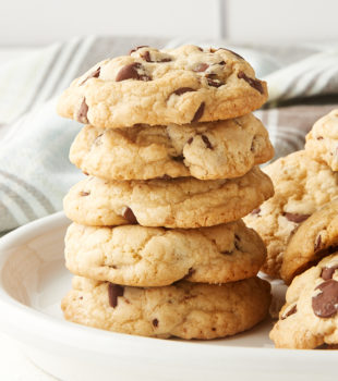 stack of Chewy Chocolate Chip Cookies on a white plate