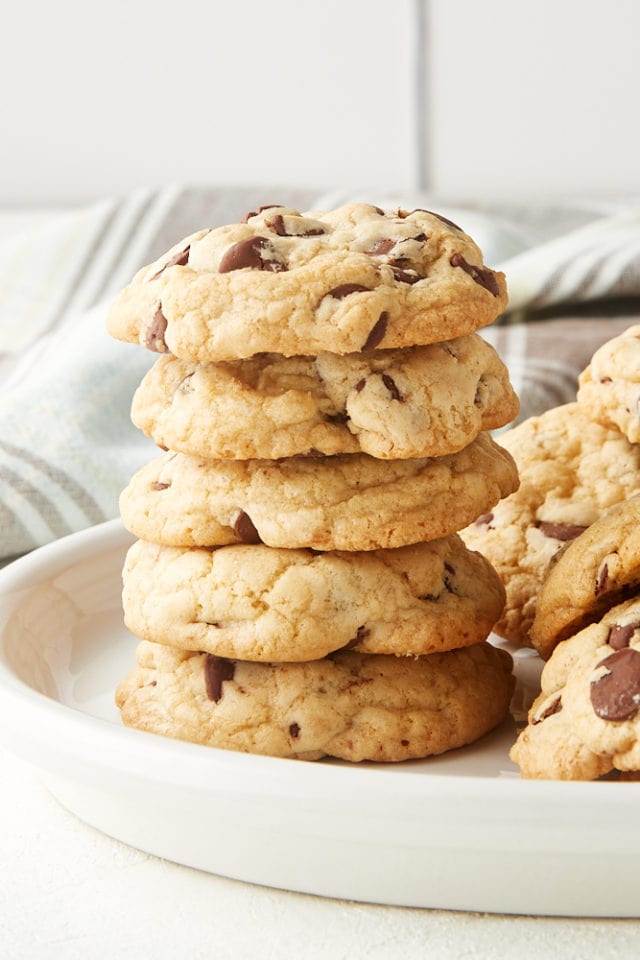 stack of Chewy Chocolate Chip Cookies on a white plate