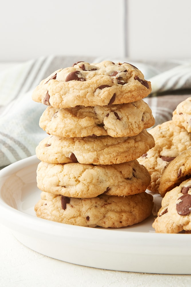 stack of Chewy Chocolate Chip Cookies on a white plate