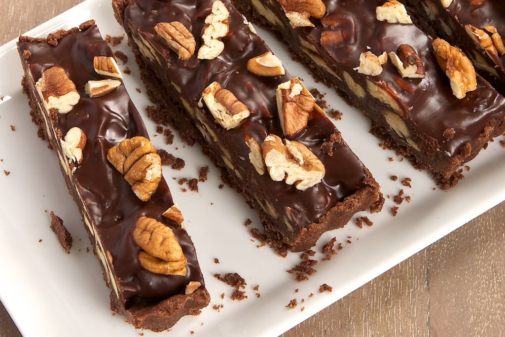 sliced Chocolate Pecan Tart on a white tray