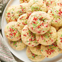 overhead view of Soft Christmas Sprinkle Sugar Cookies on a large white plate