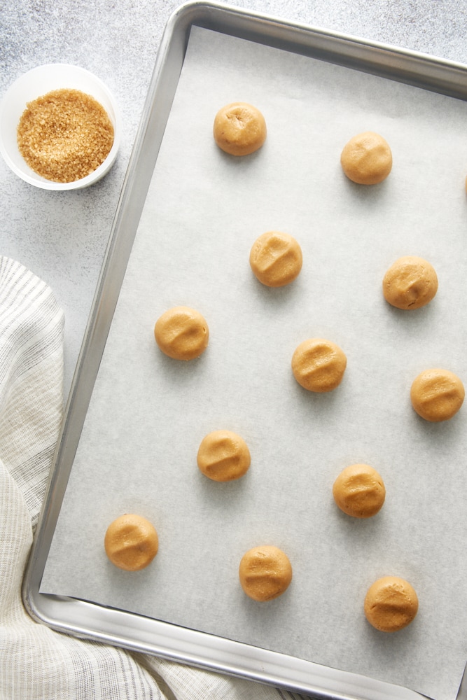 overhead view of Maple Ginger Cookie dough on a parchment-lined baking sheet