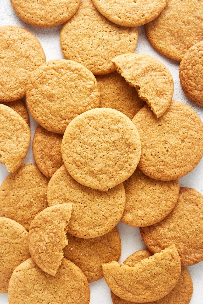 overhead view of a pile of Maple Ginger Cookies on a white surface