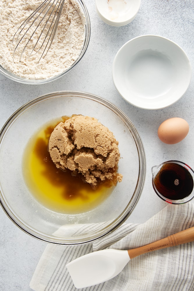 overhead view of melted butter and brown sugar in a glass mixing bowl