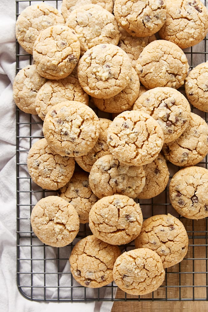 Overhead view of peanut butter crinkle cookies piled on a wire rack.