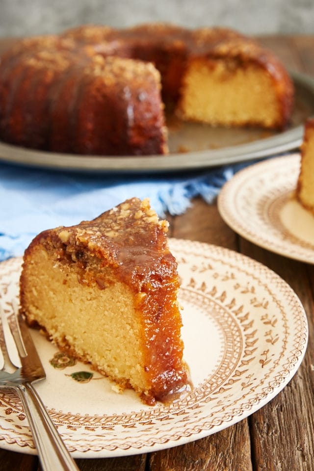 slice of Pecan Pie Bundt Cake on a brown floral plate