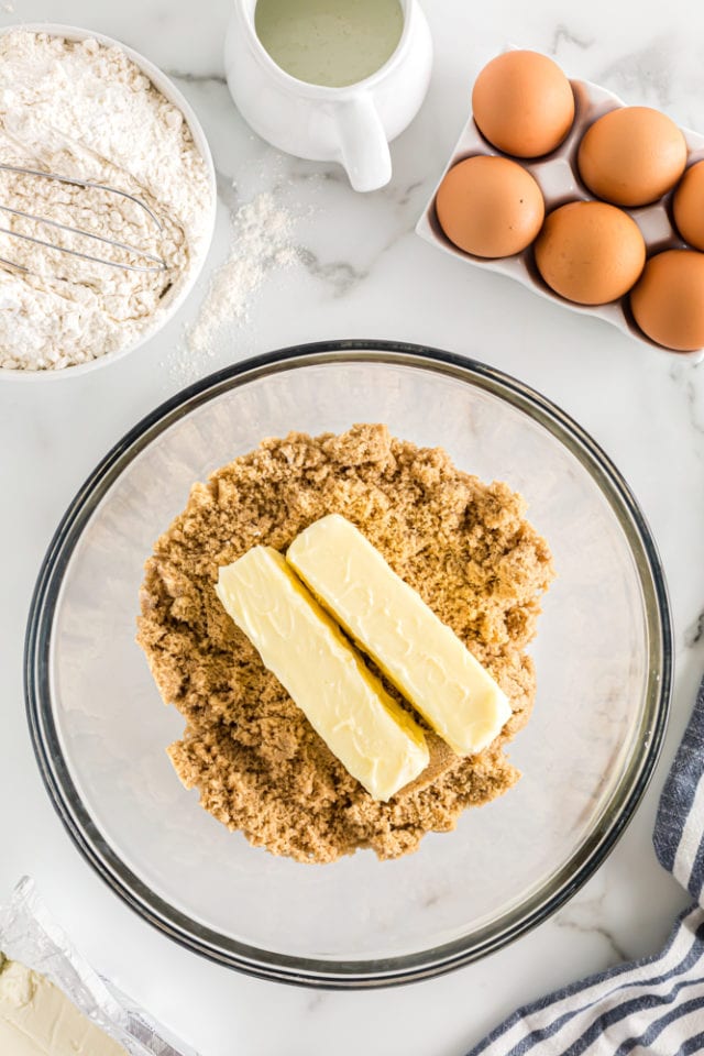 overhead view of butter and brown sugar in a glass mixing bowl