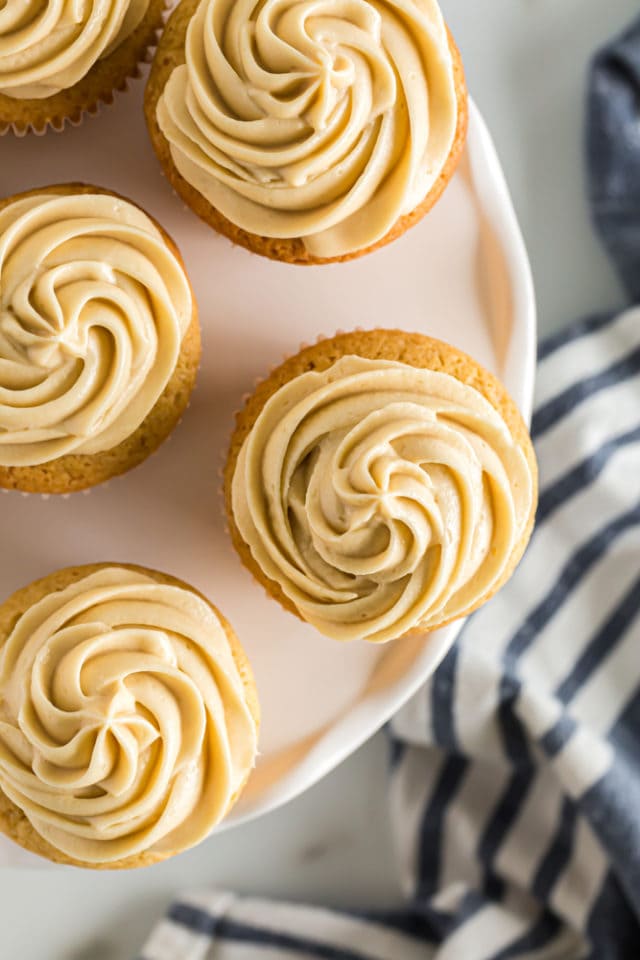 overhead view of frosted Brown Sugar Pound Cakes on a white cake stand