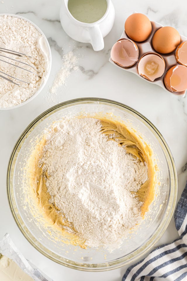 overhead view of dry ingredients added to wet ingredients for Brown Sugar Pound Cakes