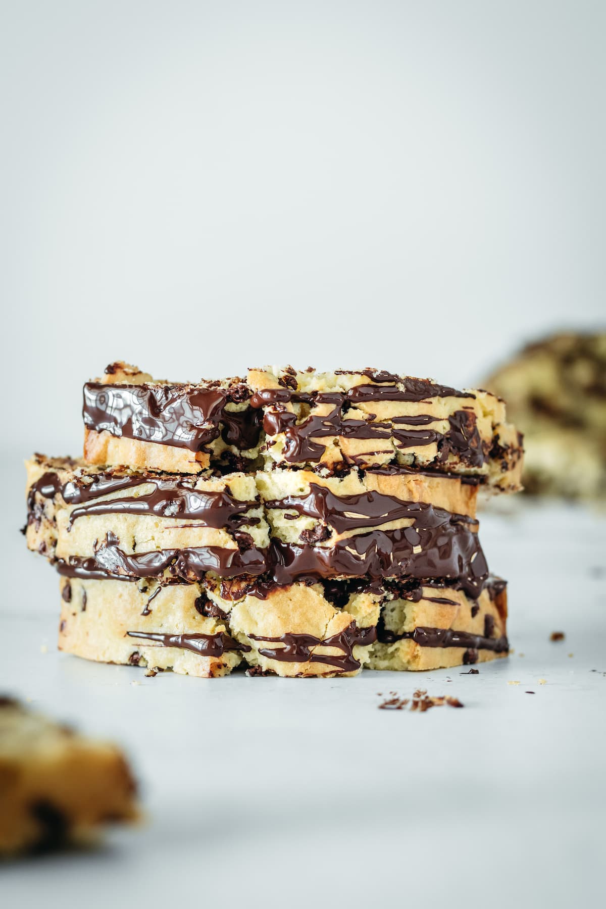 Stack of three chocolate chip cashew bread slices