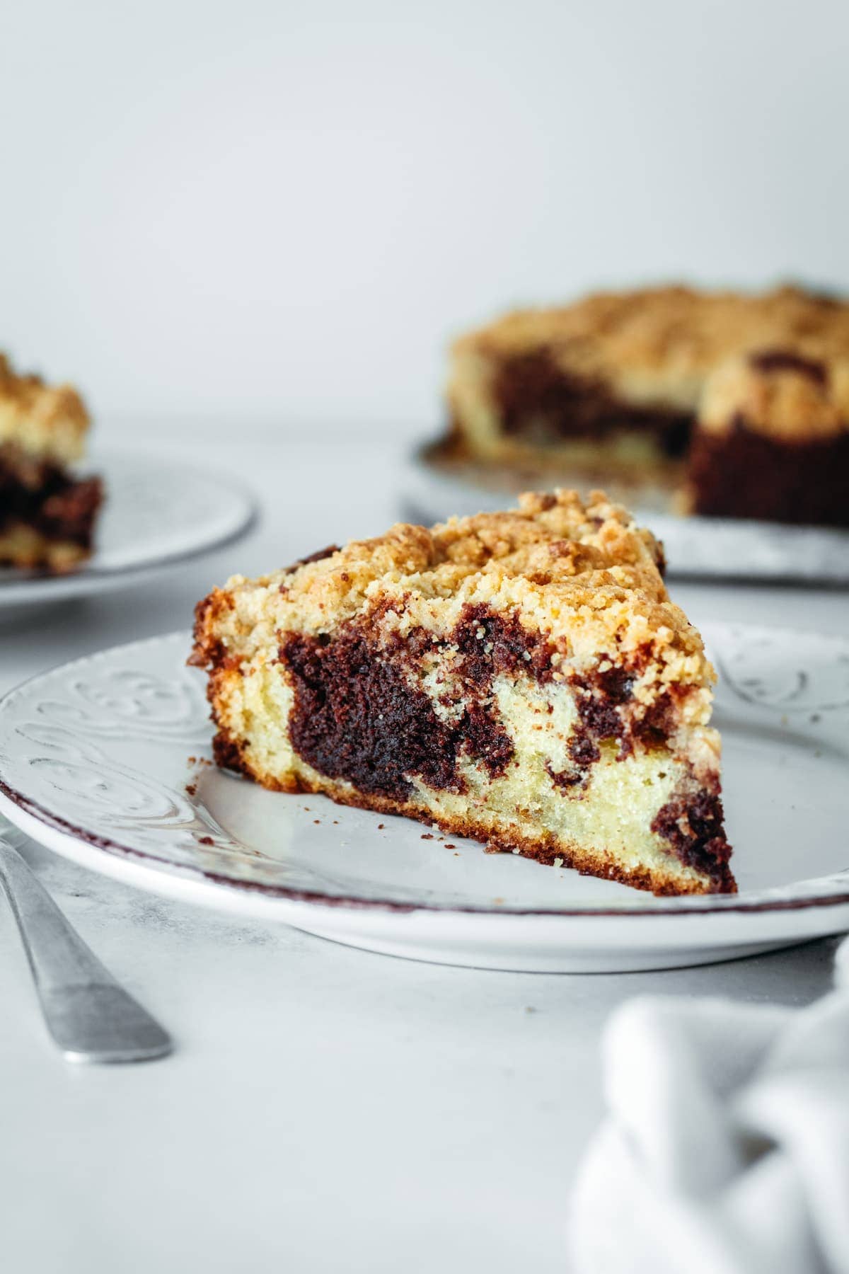 Slice of chocolate swirl coffee cake on plate