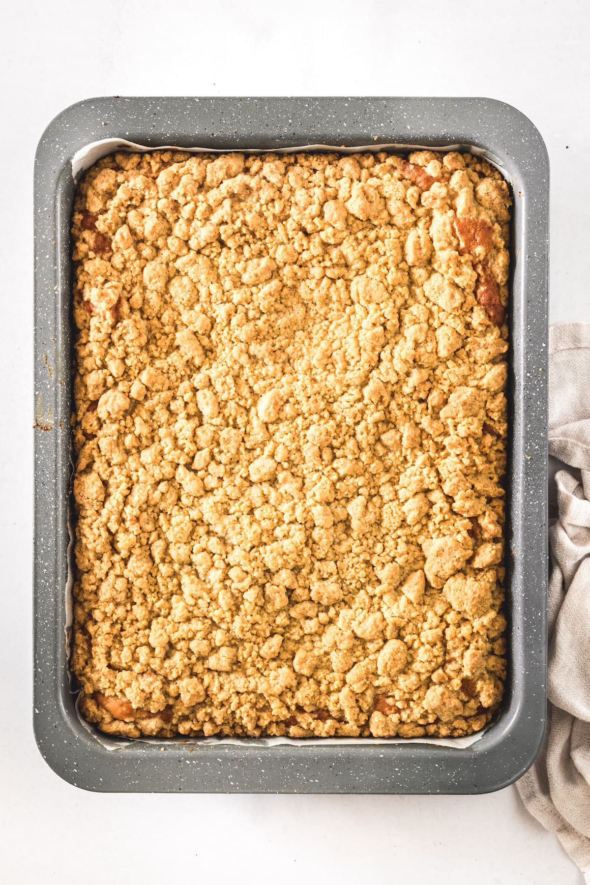 Overhead view of crumb cake in baking pan