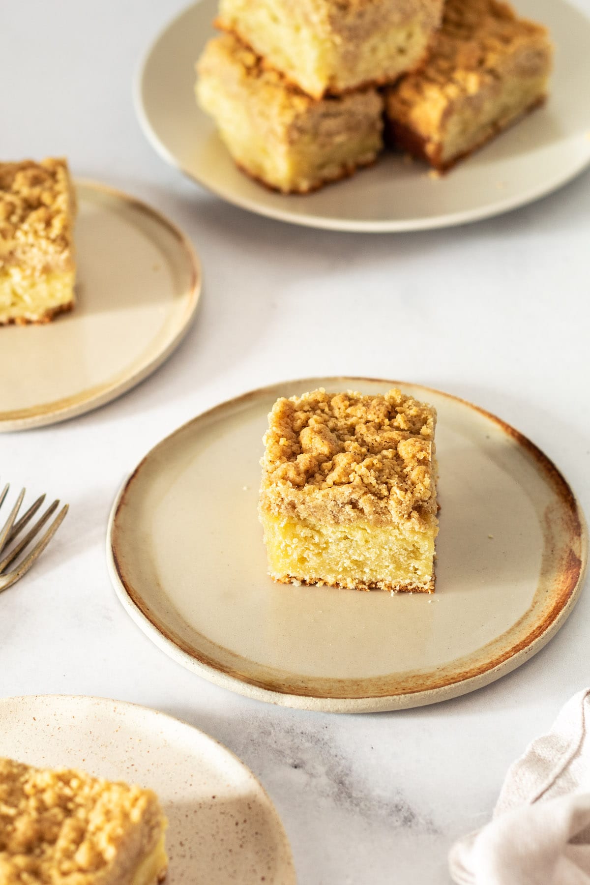 Squares of crumb cake on plates