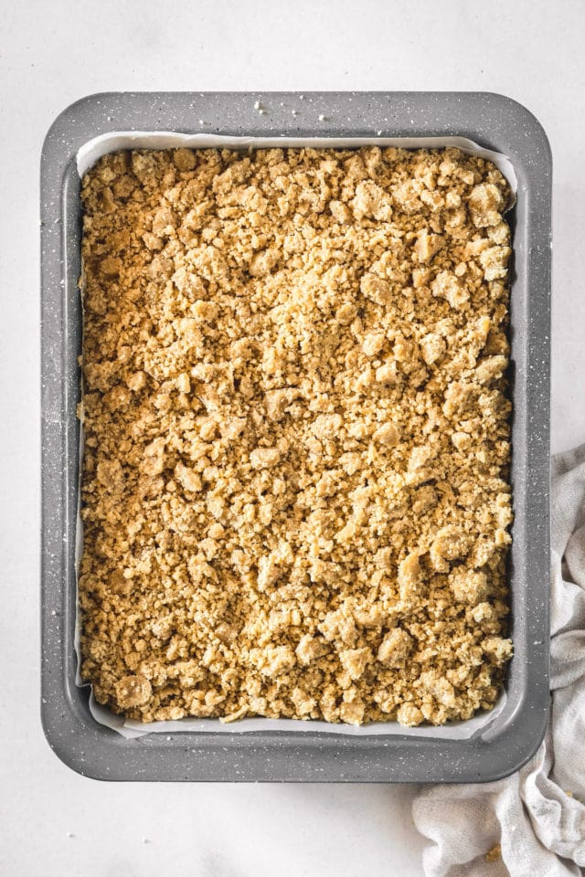 Overhead view of unbaked crumb cake in pan
