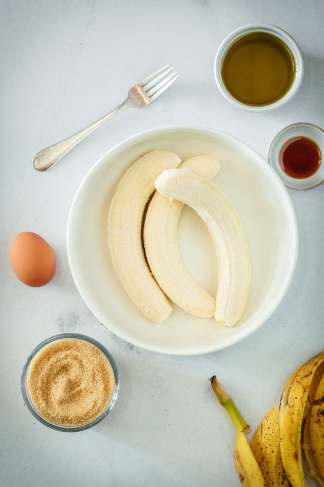 Overhead view of 3 bananas in a mixing bowl