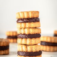 Stack of 3 peanut butter sandwich cookies with chocolate filling