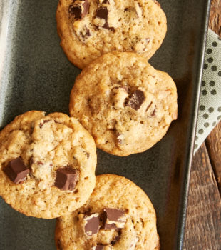 overhead view of Bourbon Pecan Chocolate Chip Cookies on a dark gray tray