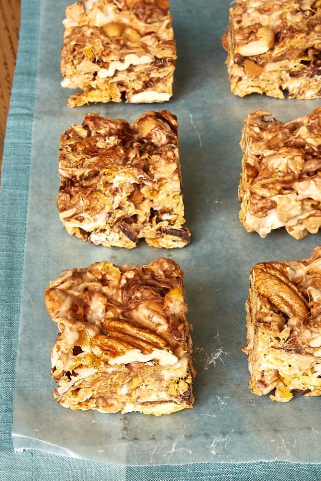 Sweet and Nutty Corn Flake Bars on waxed paper on a blue fabric