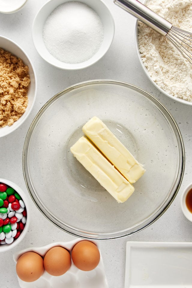 overhead view of butter in a glass mixing bowl