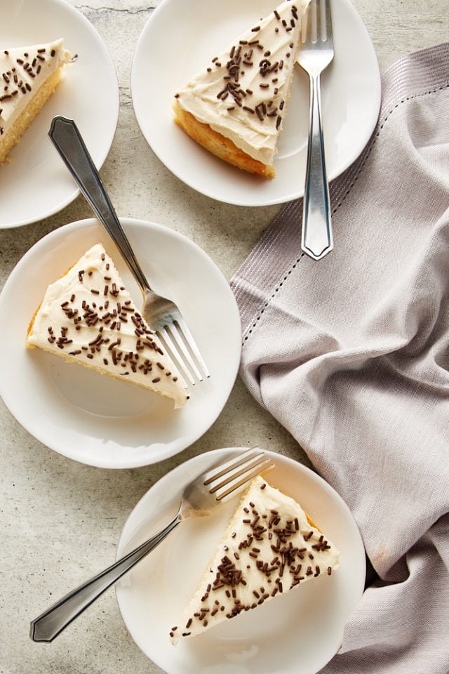 overhead view of slices of Irish Cream Cake on white plates