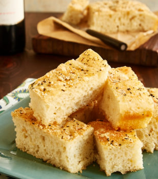 slices of Quick No-Knead Focaccia on a green plate