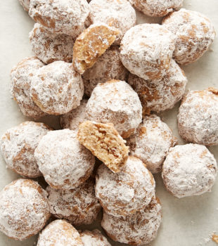 overhead view of Nutty Spiced Snowball Cookies in a pile