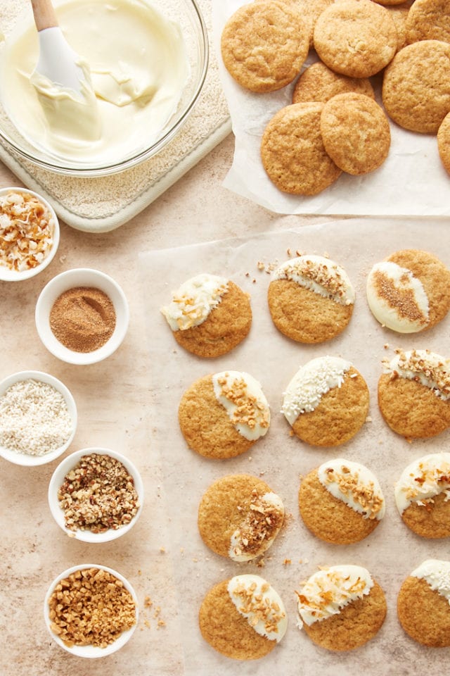 overhead view of White Chocolate Snickerdoodles being decorated with white chocolate and various topping