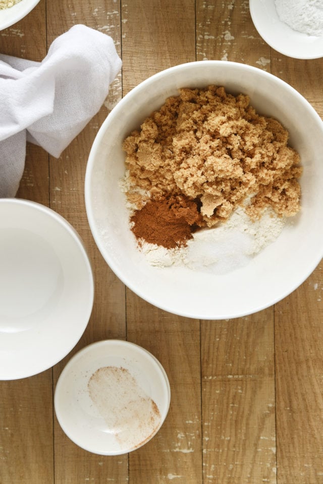 overhead view of cinnamon crumb topping ingredients in a white mixing bowl