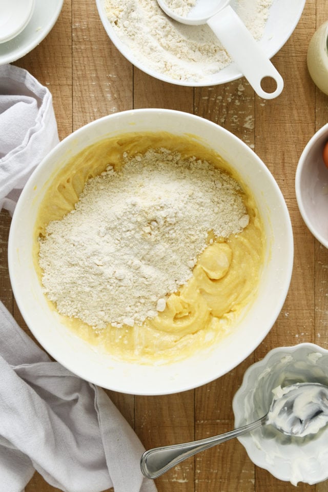 overhead view of dry ingredients added to wet ingredients for Almond Crumb Cake