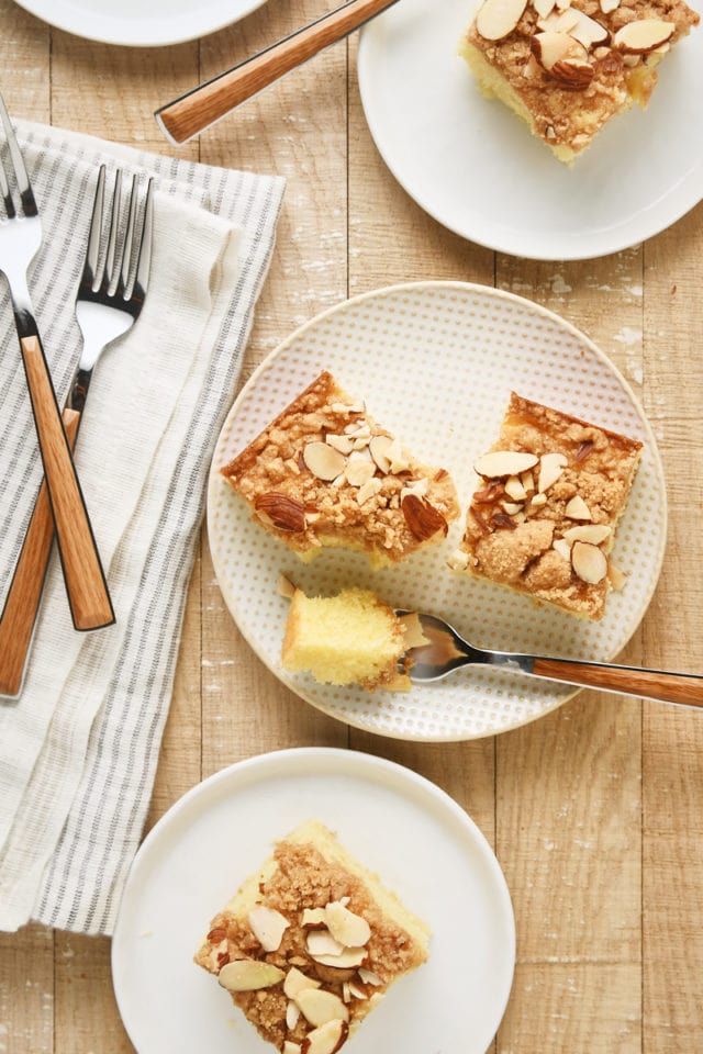 overhead view of slices of Almond Crumb Cake on white plates