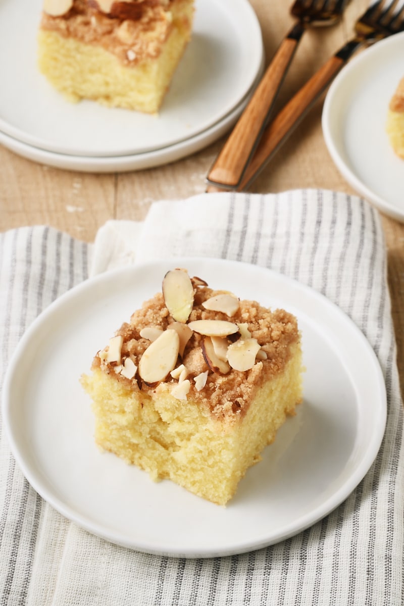 slice of Almond Crumb Cake on a round white plate