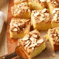 slices of Almond Crumb Cake on a wooden cutting board