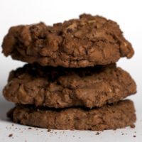 stack of Double Chocolate Cookies on a white surface