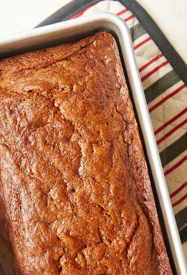 overhead view of freshly baked Dulce de Leche Banana Bread in a metal loaf pan