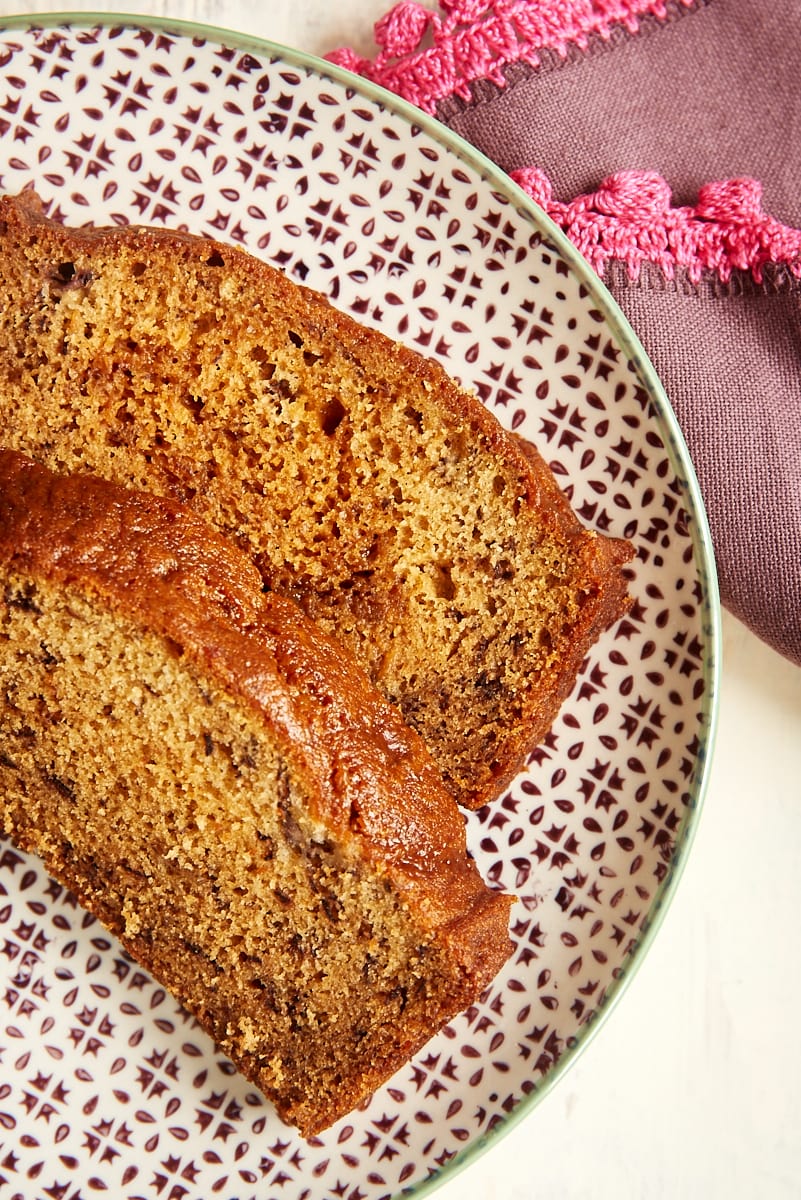 overhead view of two slices of Dulce de Leche Banana Bread on a patterned plate