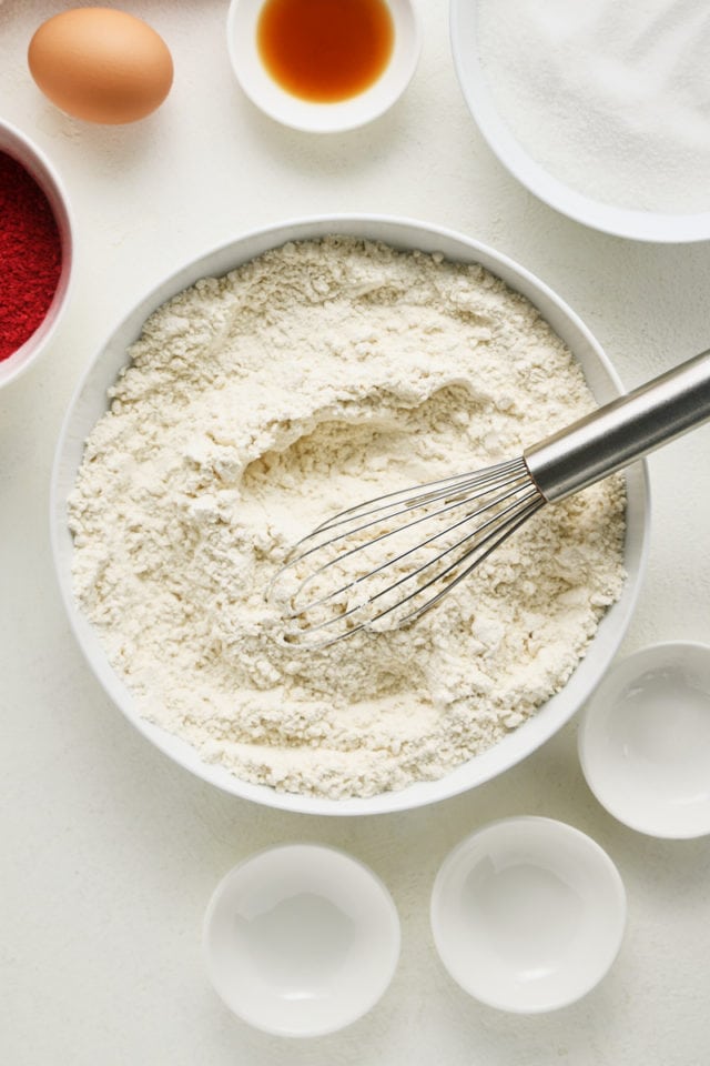 Overhead view of mixed dry ingredients for raspberry sugar cookies.