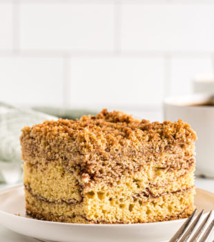 Sour cream coffee cake square on plate