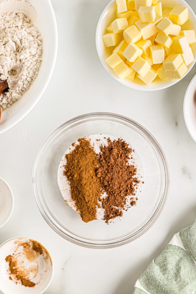 Overhead view of cocoa powder in glass bowl with sugar