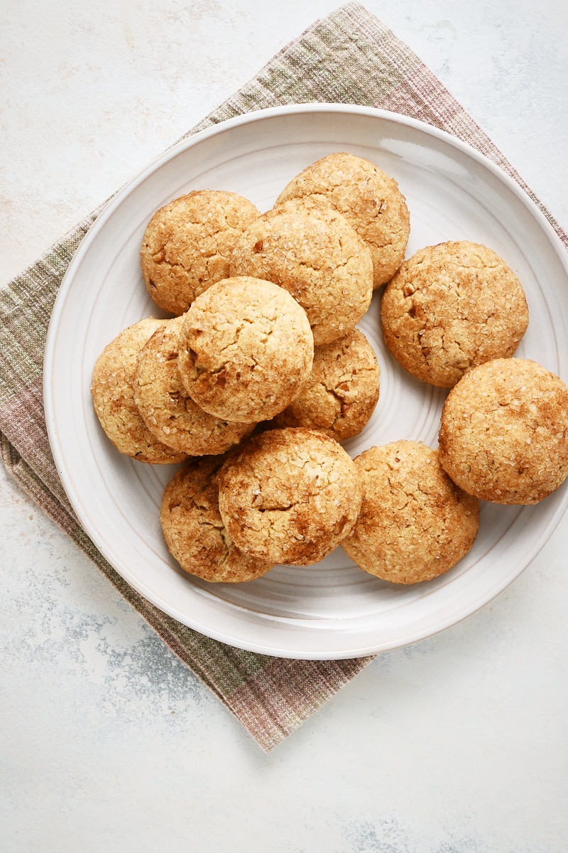 overhead view of Brown Butter Cinnamon Cookies piled on a light gray plate