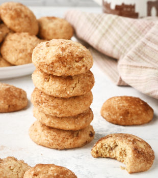 stack of Brown Butter Cinnamon Cookies with more cookies surrounding