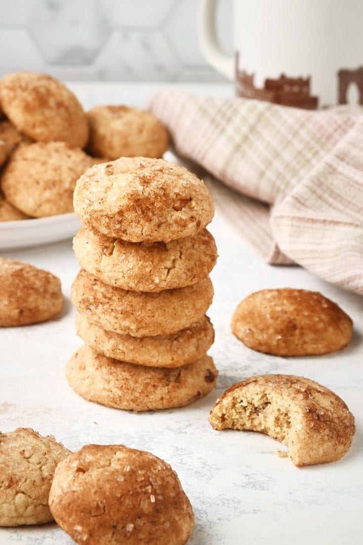 stack of Brown Butter Cinnamon Cookies with more cookies surrounding