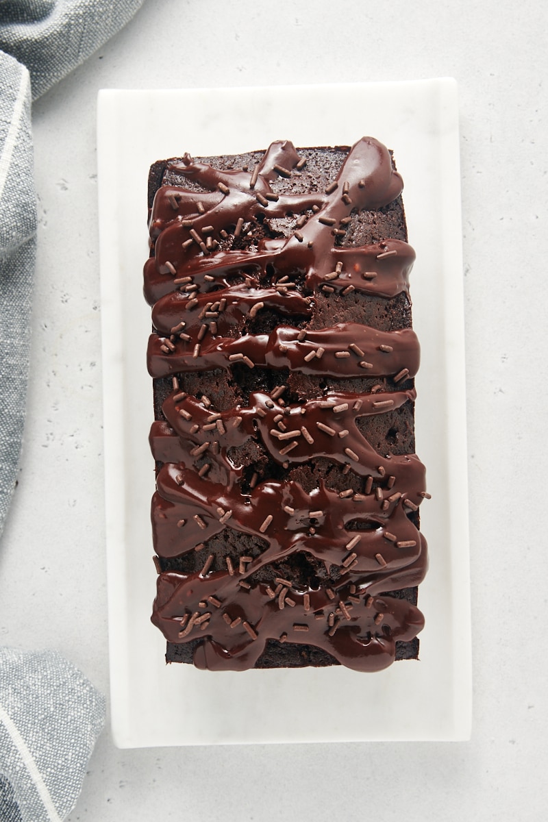 overhead view of Chocolate Loaf Cake with Chocolate Glaze and chocolate sprinkles