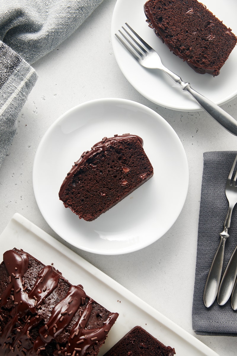 overhead view of slices of Chocolate Loaf Cake on white plates