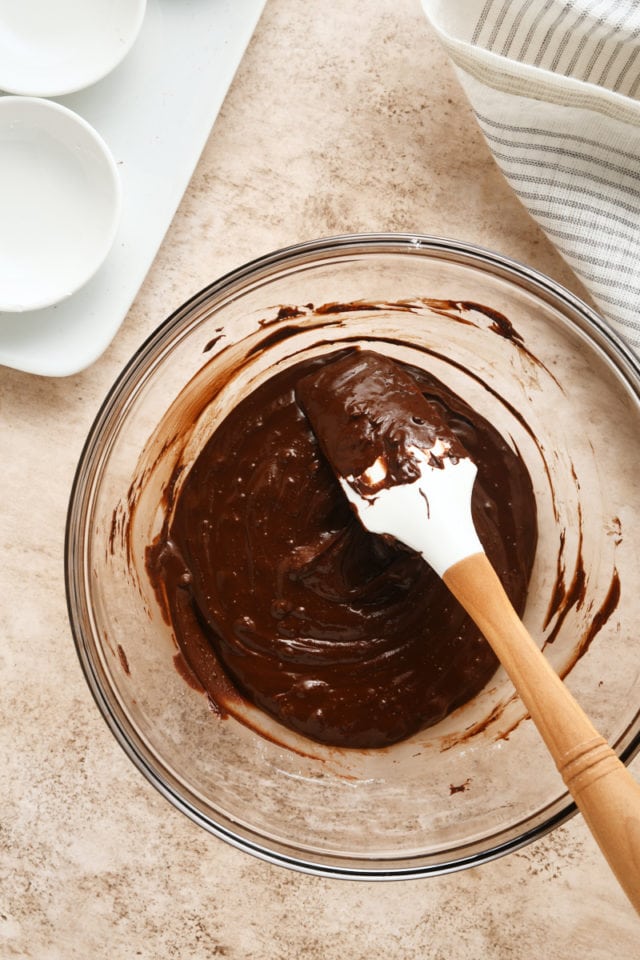 overhead view of melted chocolate mixture in a glass mixing bowl