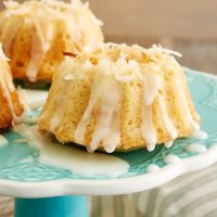 Mini Coconut Bundt Cakes on a blue cake stand