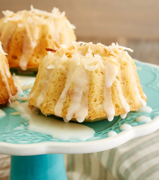 Mini Coconut Bundt Cakes on a blue cake stand