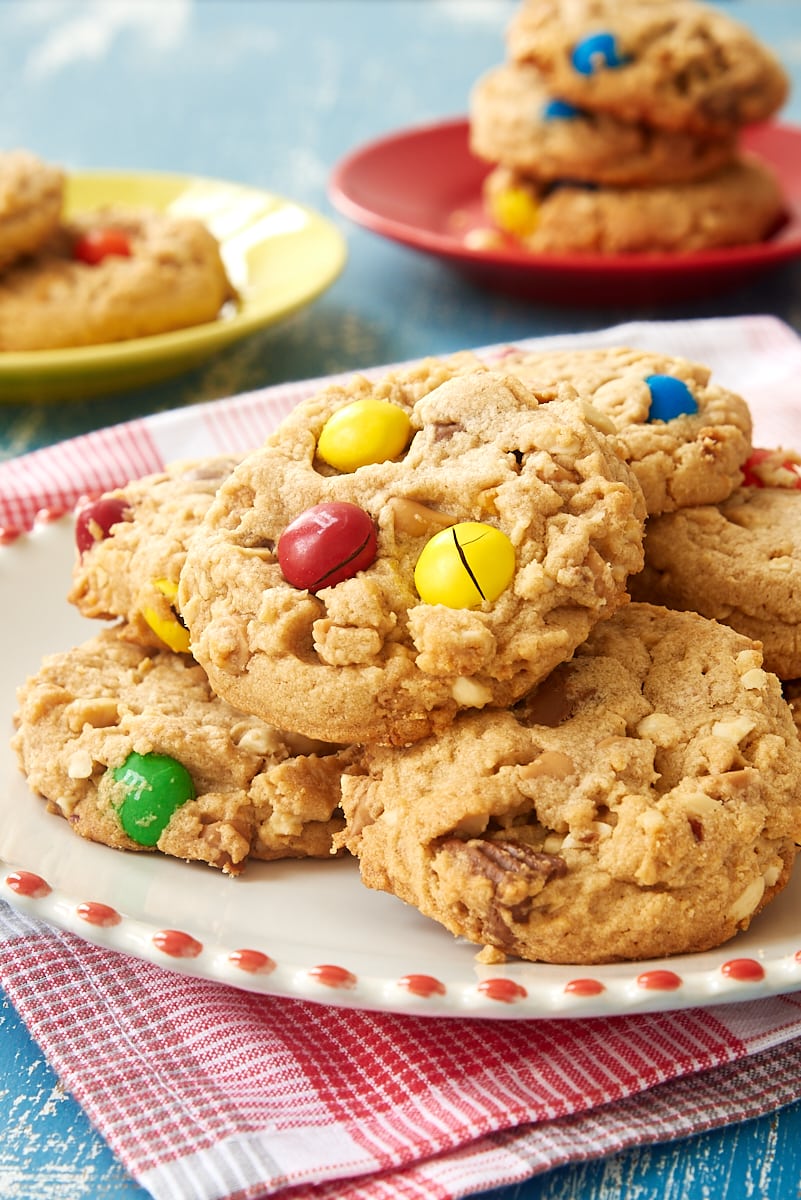 Peanut Butter Lovers' Cookies piled on a red-trimmed white plate