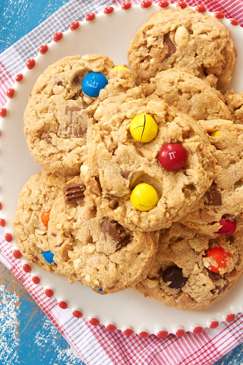 overhead view of Peanut Butter Lovers' Cookies on a red-trimmed white plate